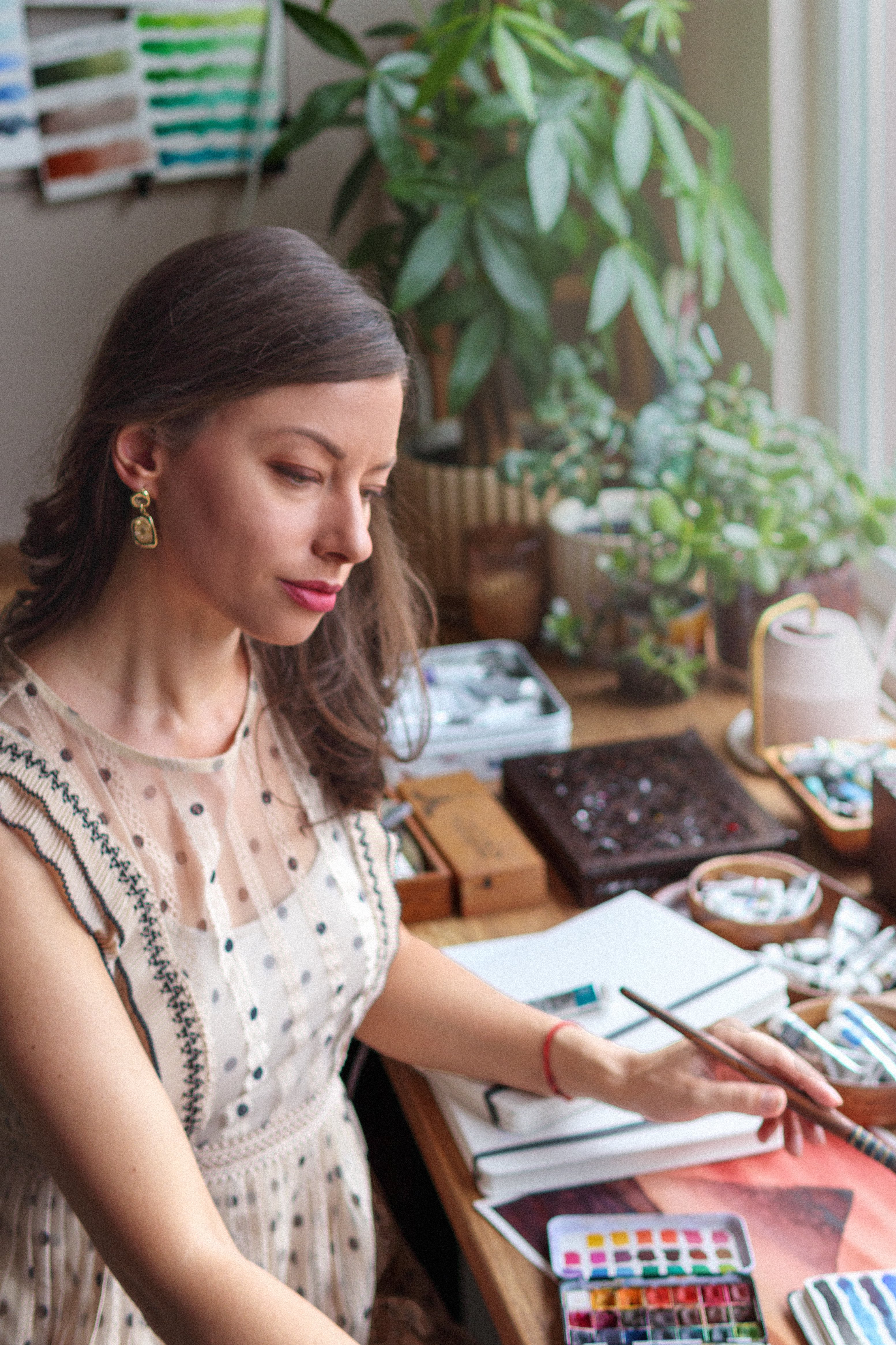 Artist Elina Zhelyazkova painting in her studio