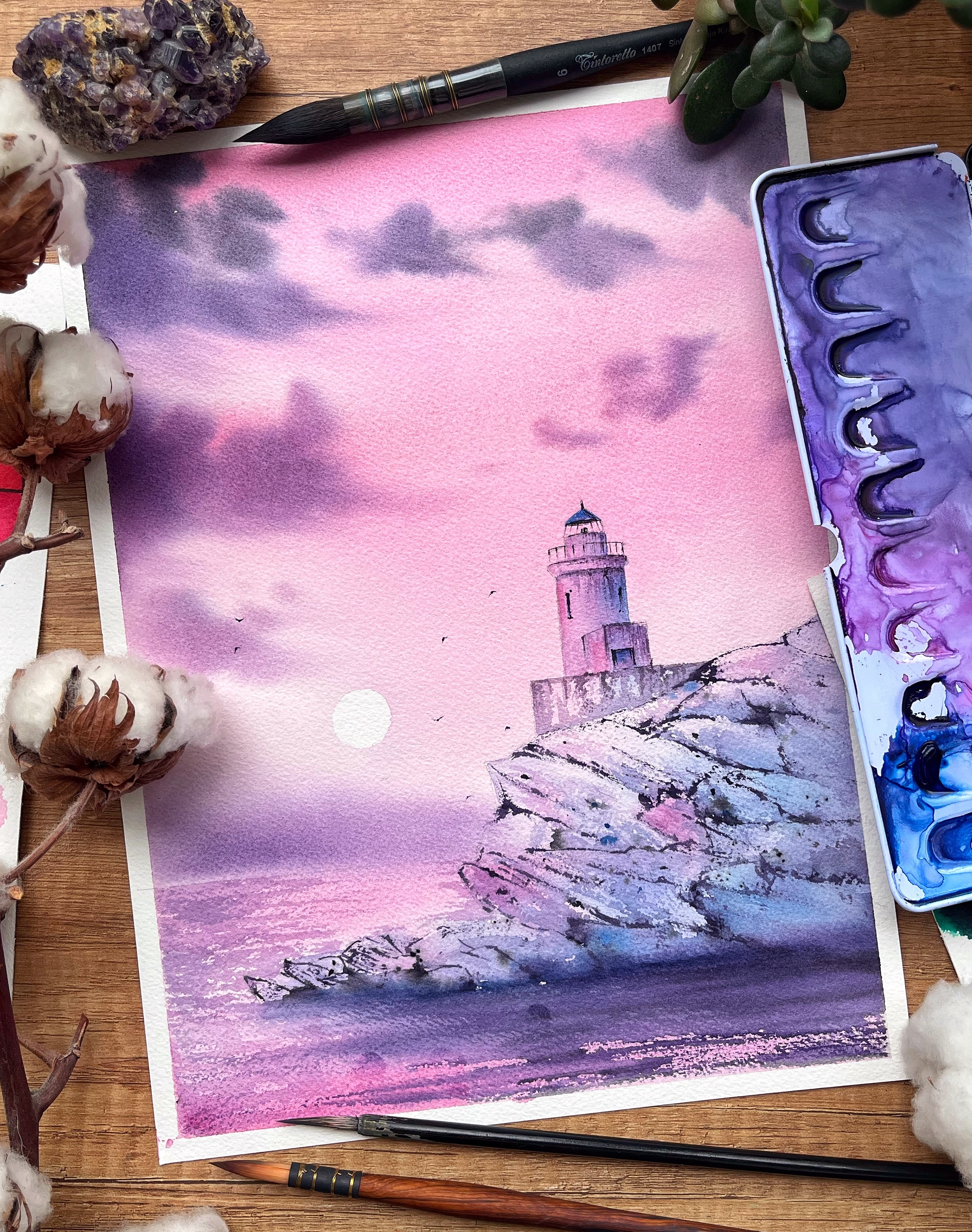 Dreamy watercolor landscape with a lighthouse on the rocks