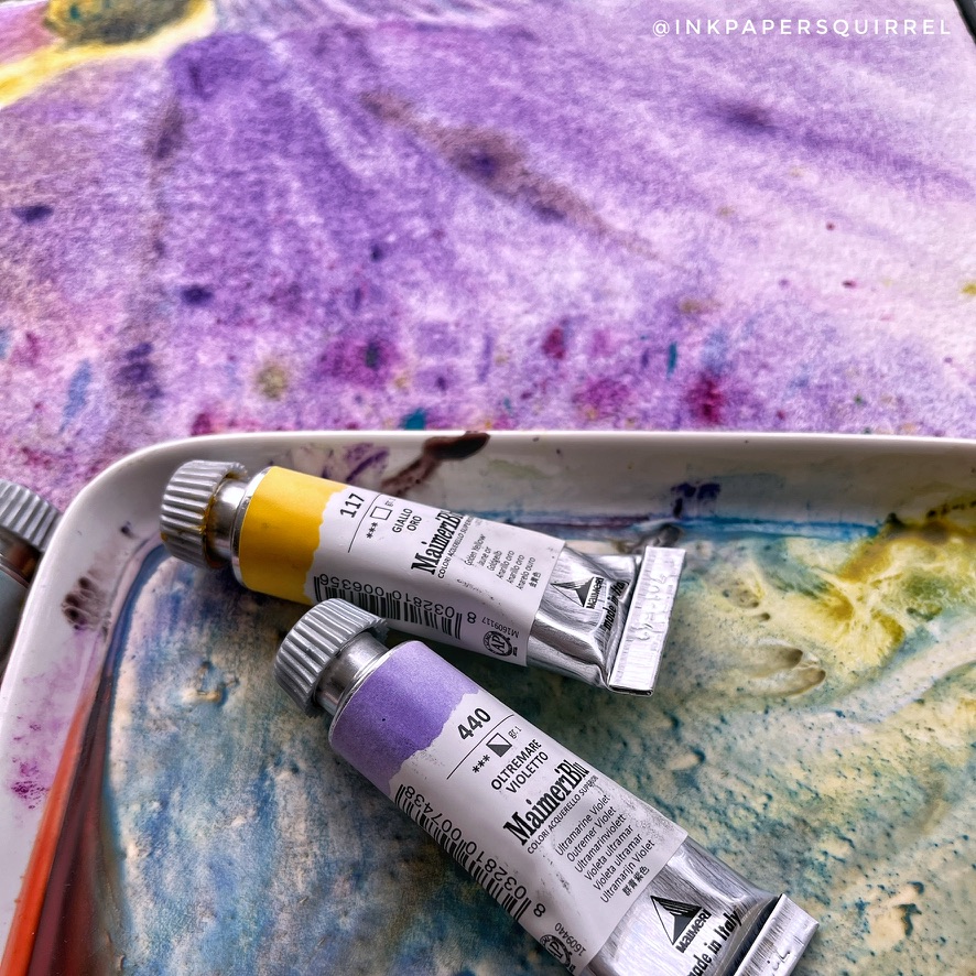 Watercolor paints on a desk, 
