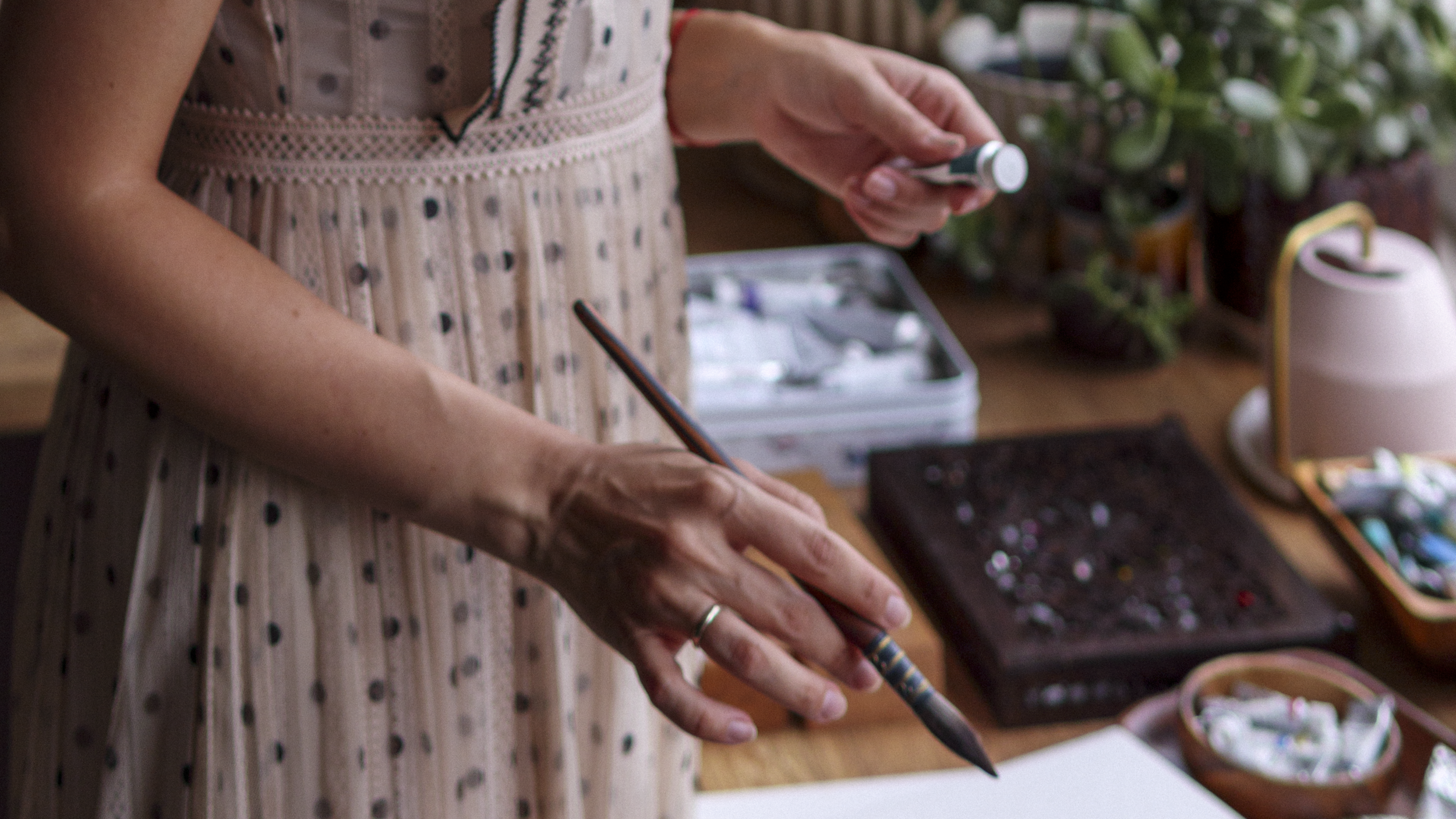 An aesthetic shot of a hand holding a brush